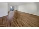 Bright living room featuring wood-look flooring and sliding glass door access to a patio at 3334 S Elm St, Tempe, AZ 85282