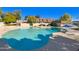 Community pool with patio tables and umbrellas at 3334 S Elm St, Tempe, AZ 85282