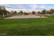 Community park with paved basketball court and surrounding trees at 3469 E Cabazon Ct, Gilbert, AZ 85297