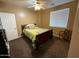 Cozy bedroom with a double bed and ceiling fan at 3469 E Cabazon Ct, Gilbert, AZ 85297