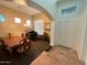 Elegant dining room with hardwood table and piano at 3469 E Cabazon Ct, Gilbert, AZ 85297