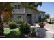 Front view of a two-story house with a fountain and landscaping at 3469 E Cabazon Ct, Gilbert, AZ 85297