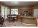 Eat-in kitchen with granite countertops and wood cabinetry at 3469 E Cabazon Ct, Gilbert, AZ 85297