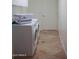 Laundry room with washer, dryer, and extra storage at 3469 E Cabazon Ct, Gilbert, AZ 85297