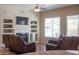 Cozy living room with fireplace and built-in shelving at 3469 E Cabazon Ct, Gilbert, AZ 85297