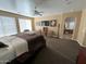 Main bedroom suite with sitting area and ensuite bathroom access at 3469 E Cabazon Ct, Gilbert, AZ 85297