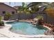 Freeform swimming pool with waterfall feature at 3469 E Cabazon Ct, Gilbert, AZ 85297