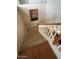 Upstairs hallway with wooden railing and artwork at 3469 E Cabazon Ct, Gilbert, AZ 85297