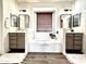 Spa-like bathroom with double vanity and a soaking tub at 3948 E Morelos St, Gilbert, AZ 85295