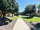 Well-manicured pathway winds through lush landscaping, offering a serene walking experience at 3948 E Morelos St, Gilbert, AZ 85295