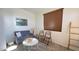 Cozy sitting area featuring a gray sofa and wood accents at 3948 E Morelos St, Gilbert, AZ 85295