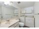 Bathroom with a large mirror and modern washer and dryer at 4201 E Camelback Rd # 25, Phoenix, AZ 85018