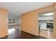 Modern kitchen adjacent to the living room featuring white cabinets and stainless steel appliances, blending style with functionality at 4201 E Camelback Rd # 25, Phoenix, AZ 85018