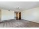 Spacious living room showcasing neutral carpet, fresh paint, ceiling fan, and an open layout leading to other living spaces at 4201 E Camelback Rd # 25, Phoenix, AZ 85018