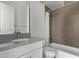 Bathroom with granite countertop, white cabinets, shower, and bathtub at 421 W 6Th St # 1009, Tempe, AZ 85281