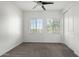 Bright bedroom with two windows, ceiling fan, and grey carpet at 421 W 6Th St # 1009, Tempe, AZ 85281