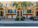 Three-unit townhome building with attached garages and private balconies at 421 W 6Th St # 1009, Tempe, AZ 85281