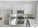 Modern kitchen with stainless steel appliances and granite countertops at 421 W 6Th St # 1009, Tempe, AZ 85281