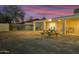 Backyard with covered patio, picnic table, and large lot at 4216 N 72Nd Ln, Phoenix, AZ 85033