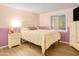 Bedroom with light wood furniture and a floral comforter at 4216 N 72Nd Ln, Phoenix, AZ 85033