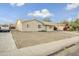 Tan single story house with front yard and driveway at 4216 N 72Nd Ln, Phoenix, AZ 85033