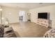 Living room with sofa, TV, and shelving at 4216 N 72Nd Ln, Phoenix, AZ 85033