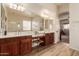 Elegant Primary bathroom with dual vanities and a soaking tub at 4221 E Carriage Way, Gilbert, AZ 85297