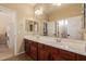 Bathroom features double vanity and large mirror at 4221 E Carriage Way, Gilbert, AZ 85297