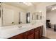 Bathroom with double vanity and large mirror at 4221 E Carriage Way, Gilbert, AZ 85297