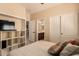 Bedroom with built-in shelving and ensuite bathroom at 4221 E Carriage Way, Gilbert, AZ 85297