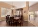 Formal dining area with a wood table and a view of the backyard at 4221 E Carriage Way, Gilbert, AZ 85297