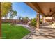 Covered patio with outdoor kitchen and access to backyard at 4221 E Carriage Way, Gilbert, AZ 85297