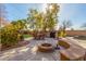 Outdoor patio area with seating, fire pit, and string lights at 4221 E Carriage Way, Gilbert, AZ 85297