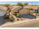 Single-story home with a two-car garage and front yard landscaping at 4233 E Creosote Dr, Cave Creek, AZ 85331