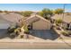 Single-story home with two-car garage and landscaped yard at 4233 E Creosote Dr, Cave Creek, AZ 85331