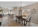 Open concept dining room with wood table and view into living room at 4233 E Creosote Dr, Cave Creek, AZ 85331