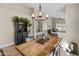 Rustic farmhouse dining room with wood table and chandelier at 4233 E Creosote Dr, Cave Creek, AZ 85331