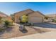 Single-story house with tan exterior, two-car garage, and desert landscaping at 4233 E Creosote Dr, Cave Creek, AZ 85331