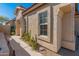 Tan stucco home exterior with walkway and desert landscaping at 4233 E Creosote Dr, Cave Creek, AZ 85331