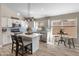 Modern kitchen with white cabinets, center island, and stainless steel appliances at 4233 E Creosote Dr, Cave Creek, AZ 85331