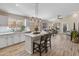 Modern kitchen with white cabinets, island, and stainless steel appliances at 4233 E Creosote Dr, Cave Creek, AZ 85331