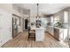 Bright kitchen with white cabinets, island, and stainless steel appliances at 4233 E Creosote Dr, Cave Creek, AZ 85331