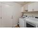 Laundry room with washer, dryer, and cabinets at 4233 E Creosote Dr, Cave Creek, AZ 85331