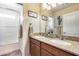 Bathroom with double vanity and shower/tub combo at 4333 W Shaw Butte Dr, Glendale, AZ 85304