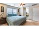 Spacious bedroom with a large bed and ensuite bathroom access at 4333 W Shaw Butte Dr, Glendale, AZ 85304