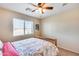 Cozy bedroom featuring a double bed and ceiling fan at 4333 W Shaw Butte Dr, Glendale, AZ 85304