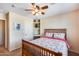 Spacious bedroom with built-in shelves and ceiling fan at 4333 W Shaw Butte Dr, Glendale, AZ 85304