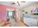 Bedroom with changing table and mirrored closet at 4333 W Shaw Butte Dr, Glendale, AZ 85304