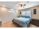 Spacious bedroom featuring a ceiling fan and large window at 4333 W Shaw Butte Dr, Glendale, AZ 85304