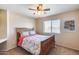 Bright bedroom with a double bed and ceiling fan at 4333 W Shaw Butte Dr, Glendale, AZ 85304